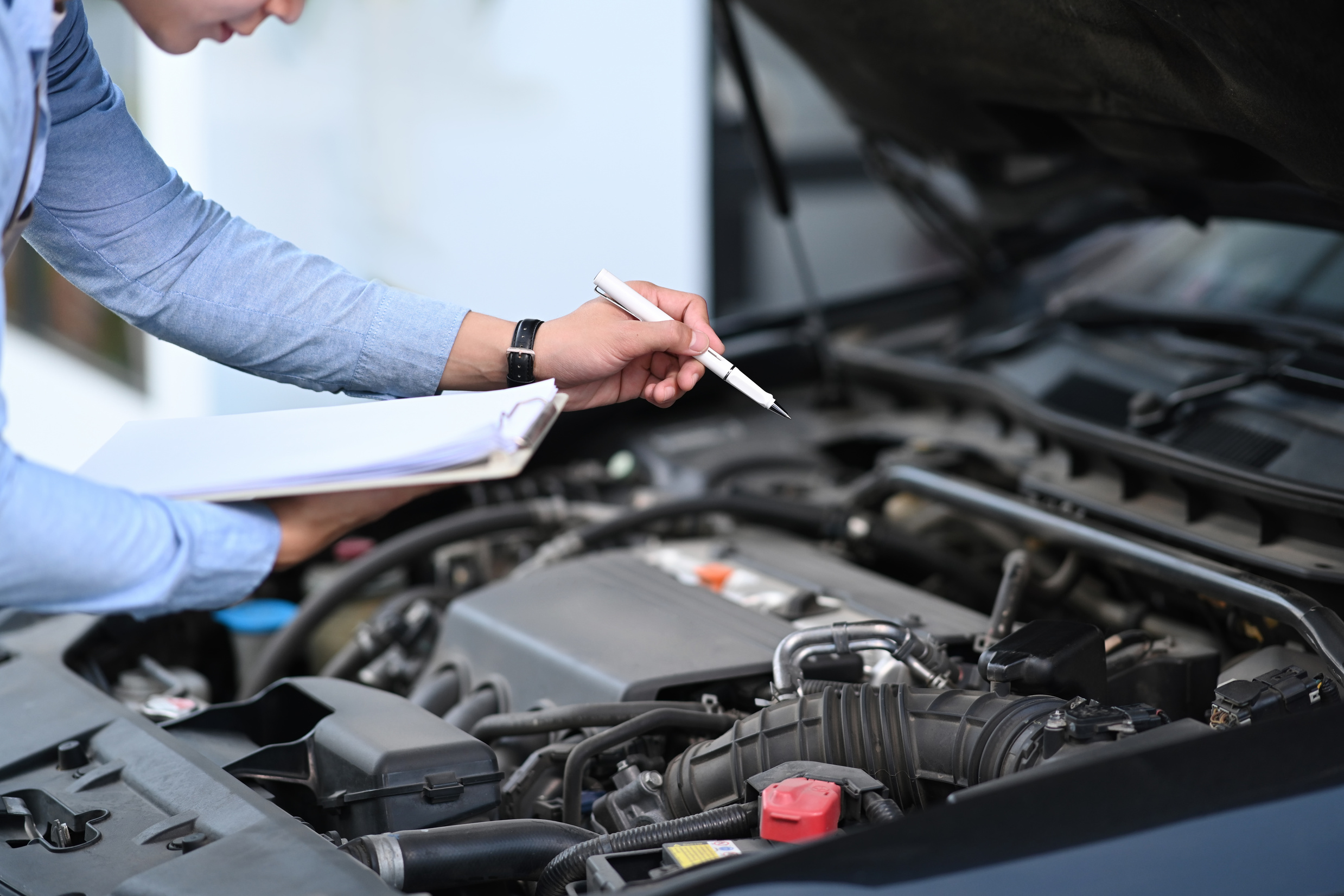 Cropped Shot of Asian Male Car Technician Is Maintenance for Cus